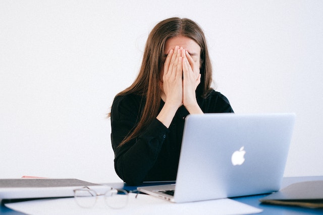 toxic positivity https://www.pexels.com/photo/woman-with-hands-on-her-face-in-front-of-a-laptop-4226215/